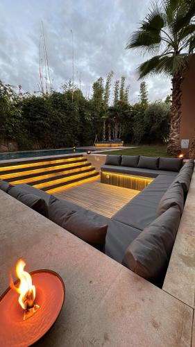 a orange plate with a fire on the ground at Villa Mattia piscine chauffée sans vis à vis in Marrakech