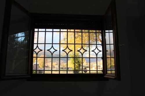 a window with a view of a city seen through it at Casablanca in Candeleda