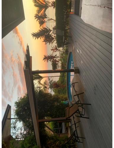 a view from a window of a building with a tree at Villa Del Mar 1 Spectacular ocean view! in Dominical