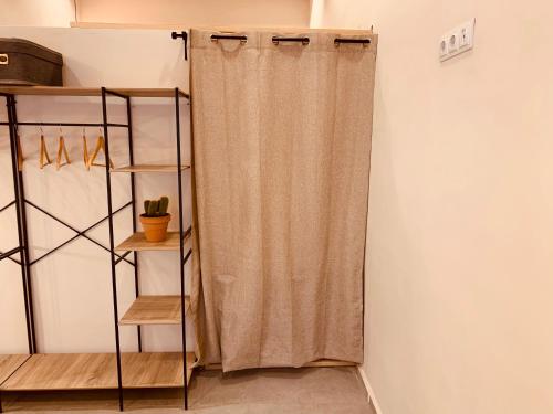 a curtain in a room with a shelf at Gook Home CENTER in Jerez de la Frontera