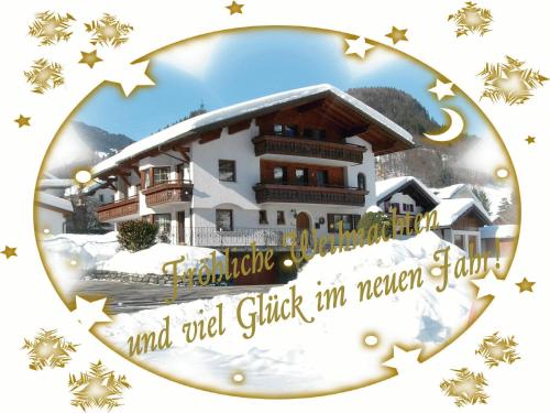 a picture of a house in the snow at Gästehaus Summer in Schruns-Tschagguns