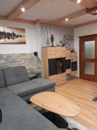 a living room with a couch and a table at Haus Wastl in Seebach