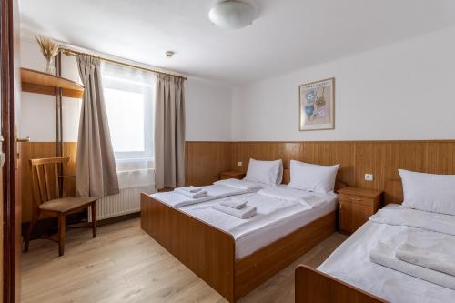 Postel nebo postele na pokoji v ubytování Robert Hotel