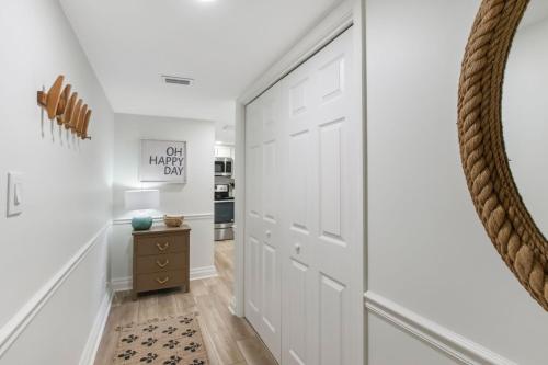 a hallway with white walls and a large white door at 1321 Shipwatch in Amelia Island