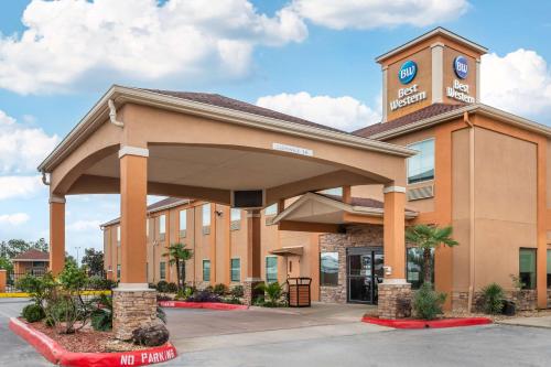 a building with a clock tower on top of it at Best Western Casino Inn in Vinton