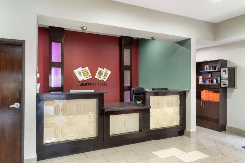 a lobby with a reception desk in a building at Best Western Casino Inn in Vinton