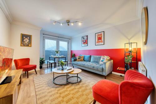 a living room with a couch and a table at Modern 2 Bed Flat with Free Parking in Glasgow