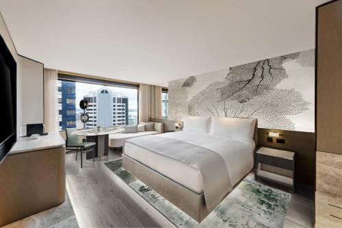 Postel nebo postele na pokoji v ubytování JW Marriott Auckland