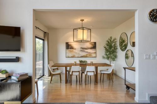 a dining room with a table and chairs at Kenwood Vista by AvantStay 7acres w Pool Fire Pit Vineyard Views in Kenwood