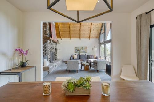 a dining room with a table and a living room at Kenwood Vista by AvantStay 7acres w Pool Fire Pit Vineyard Views in Kenwood