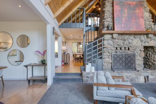 a stone fireplace in the living room of a home at Kenwood Vista by AvantStay 7acres w Pool Fire Pit Vineyard Views in Kenwood