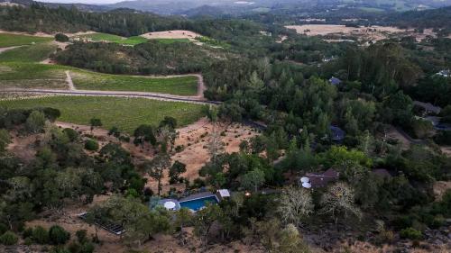 an aerial view of a farm with a house and trees at Kenwood Vista by AvantStay 7acres w Pool Fire Pit Vineyard Views in Kenwood