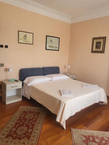 a bedroom with a bed and a table with a rug at Maison Manni' B&B in Soverato Marina