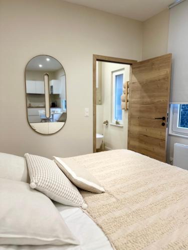 Appartement cosy à Liègeにあるベッド