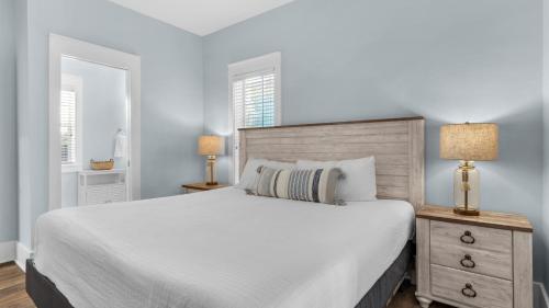 En eller flere senge i et værelse på Salty Paws Bungalow