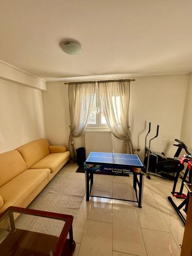 a living room with a ping pong table in it at 2K Eco Villa in Plagiárion