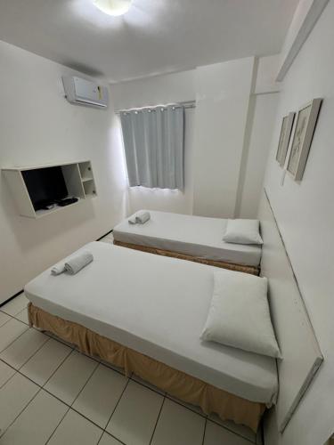 Postel nebo postele na pokoji v ubytování Flat Biarritz Ao Lado da Litorânea l Ferreira Hospedagens