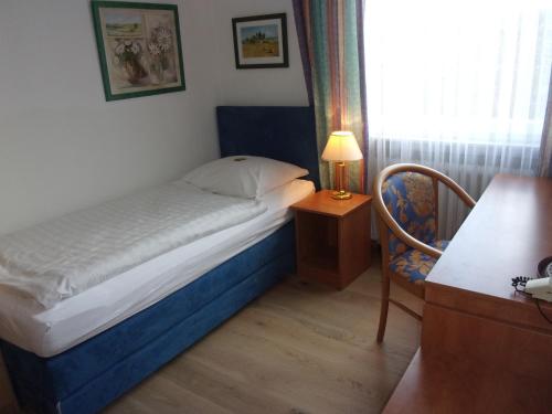Postel nebo postele na pokoji v ubytování Hotel Fährhaus