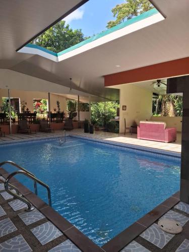 a large swimming pool with a skylight at Hotel San Rafael Ecolodge in San Gerardo