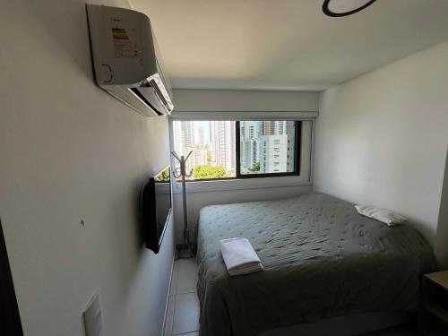 Ένα ή περισσότερα κρεβάτια σε δωμάτιο στο Flat no Hotel Beach Class By HOM