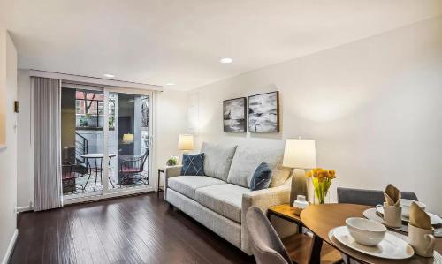 a living room with a couch and a table at Historic Capitol Hill Retreat in Washington, D.C.