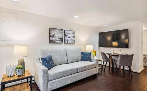 a living room with a couch and a table at Historic Capitol Hill Retreat in Washington, D.C.