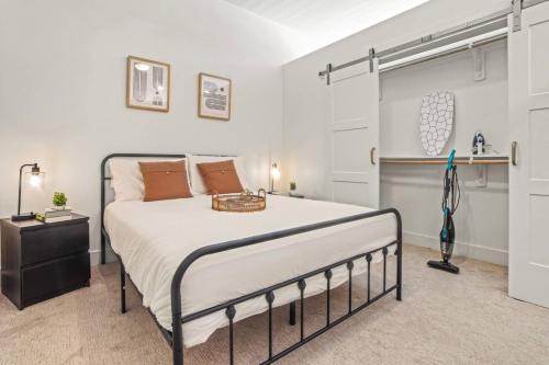 a bedroom with a large bed in a room at Pampering New Unit Studio 1Ba Pool, Golf Sim in Austin