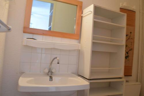 a bathroom with a sink and a mirror at SP190-119 Maison mezzanine 6 couchages SAINT PIERRE LA MER in Saint Pierre La Mer