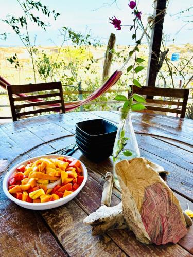 a bowl of vegetables on a wooden table at Punta Vichayo - Casa Ballenas in Talara