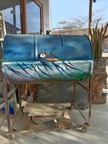 a blue boat sitting on top of a table at Punta Vichayo - Casa Ballenas in Talara