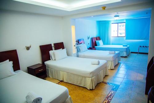 Cama o camas de una habitación en Hotel Plaza Las Américas Cali