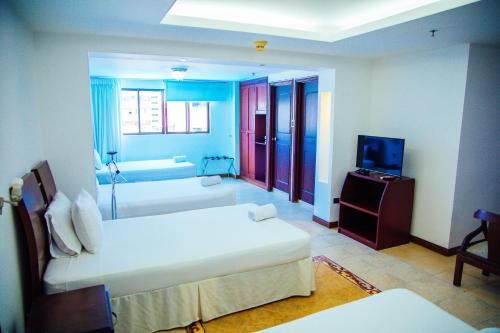 Cama o camas de una habitación en Hotel Plaza Las Américas Cali