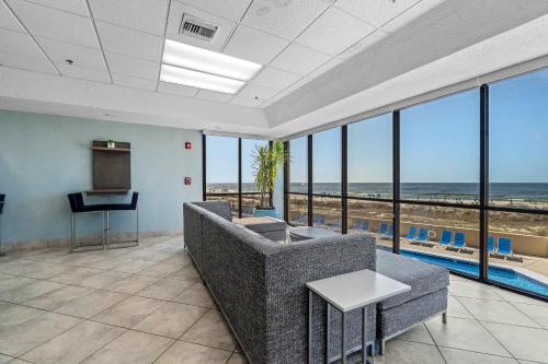 a living room with a view of the ocean at Phoenix V 902 in Orange Beach