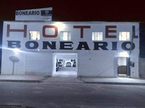 a white building with a sign that reads firebomb garage at Hotel Boneario in Vitória da Conquista