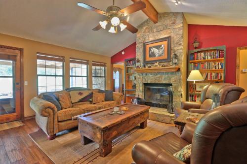 a living room with a couch and a fireplace at Honky Tonk Getaway in Driftwood