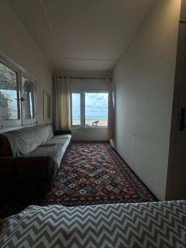 a small room with a couch and a window at Haidar Private bedroom for Men only غرف خاصه للرجال فقط 仅限男性 in Alexandria