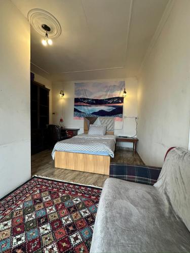 a bedroom with two beds and a rug at Haidar Private bedroom for Men only غرف خاصه للرجال فقط 仅限男性 in Alexandria