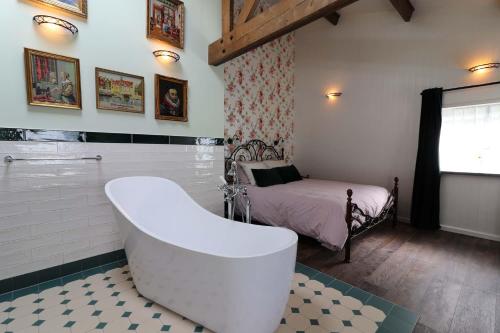 Postel nebo postele na pokoji v ubytování B&B Eemswolde