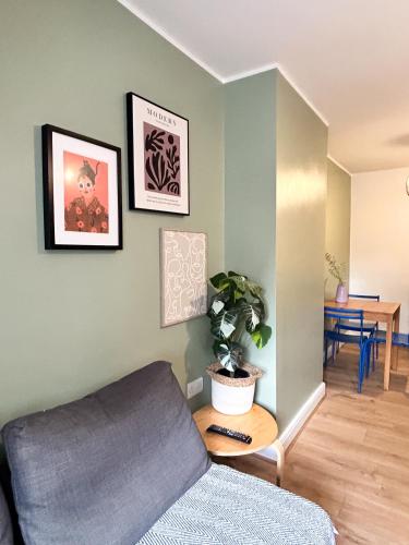 a living room with a couch and a table at GRANBY APARTMENTS F-3 in Leicester