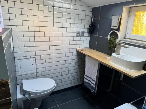 Koupelna v ubytování Le spa des canuts