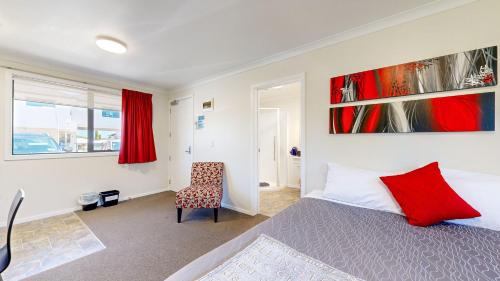 Ένα ή περισσότερα κρεβάτια σε δωμάτιο στο Matariki Motor Lodge