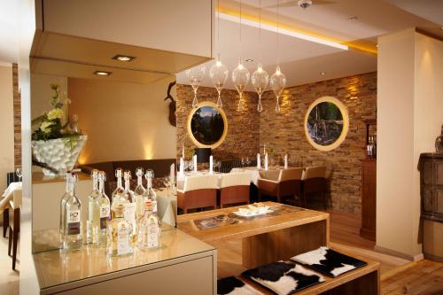 a wine tasting room with bottles on a counter at Müllers Landhotel in Medebach