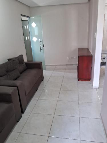 a living room with a couch and a table at Bella Vida in Garanhuns