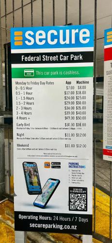 a sign for a car park in a store at Spectacular Auckland CBD Views in Auckland