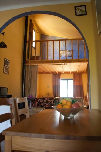 a bowl of fruit on a table in a room at El Vuelo de la Libélula in Barbate