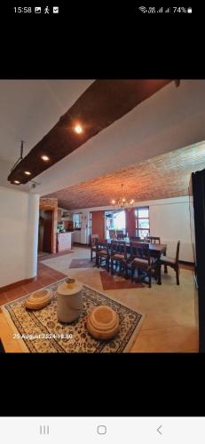 a living room with a table and a dining room at MareBob in Peršaves