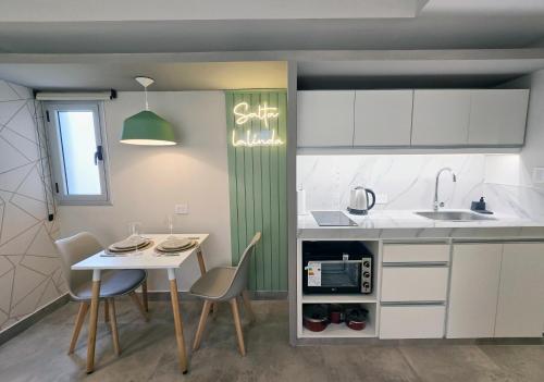 Kuchyň nebo kuchyňský kout v ubytování Hermoso dpto con vista al parque