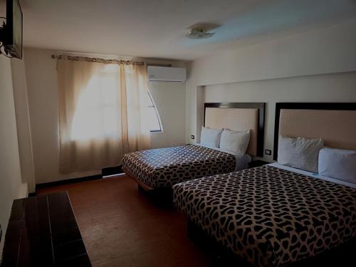 Кровать или кровати в номере Hotel Essen's