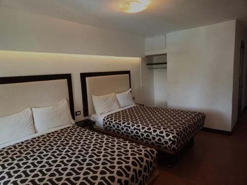 Кровать или кровати в номере Hotel Essen's