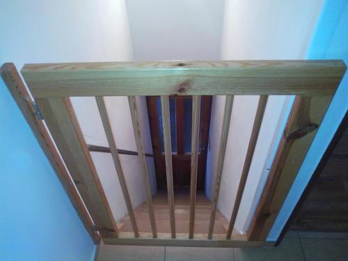 a wooden shelf in the corner of a room at Chalupa Erika in Dobšín